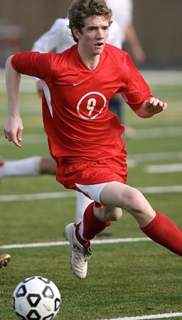 A men wearing jersey playing football